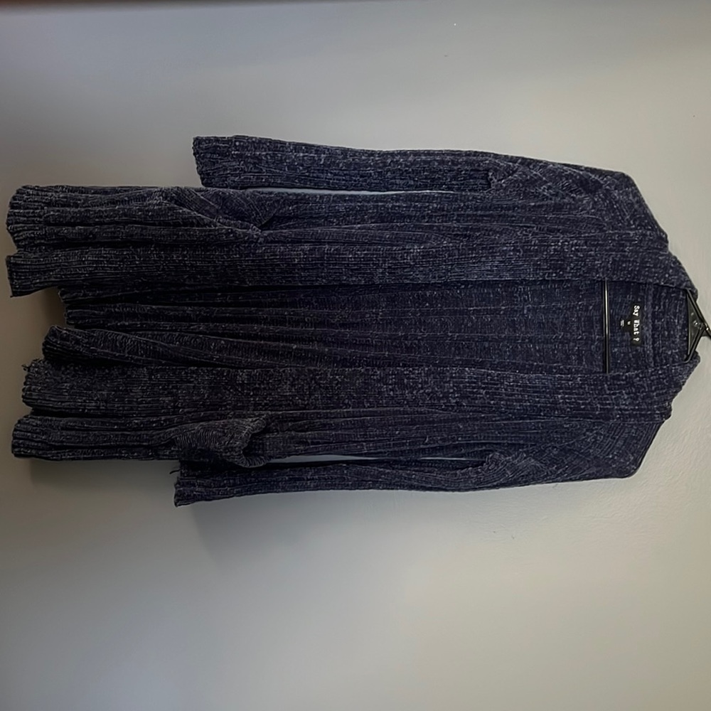 never worn medium cardigan. purchased from discovery clothing. has pockets